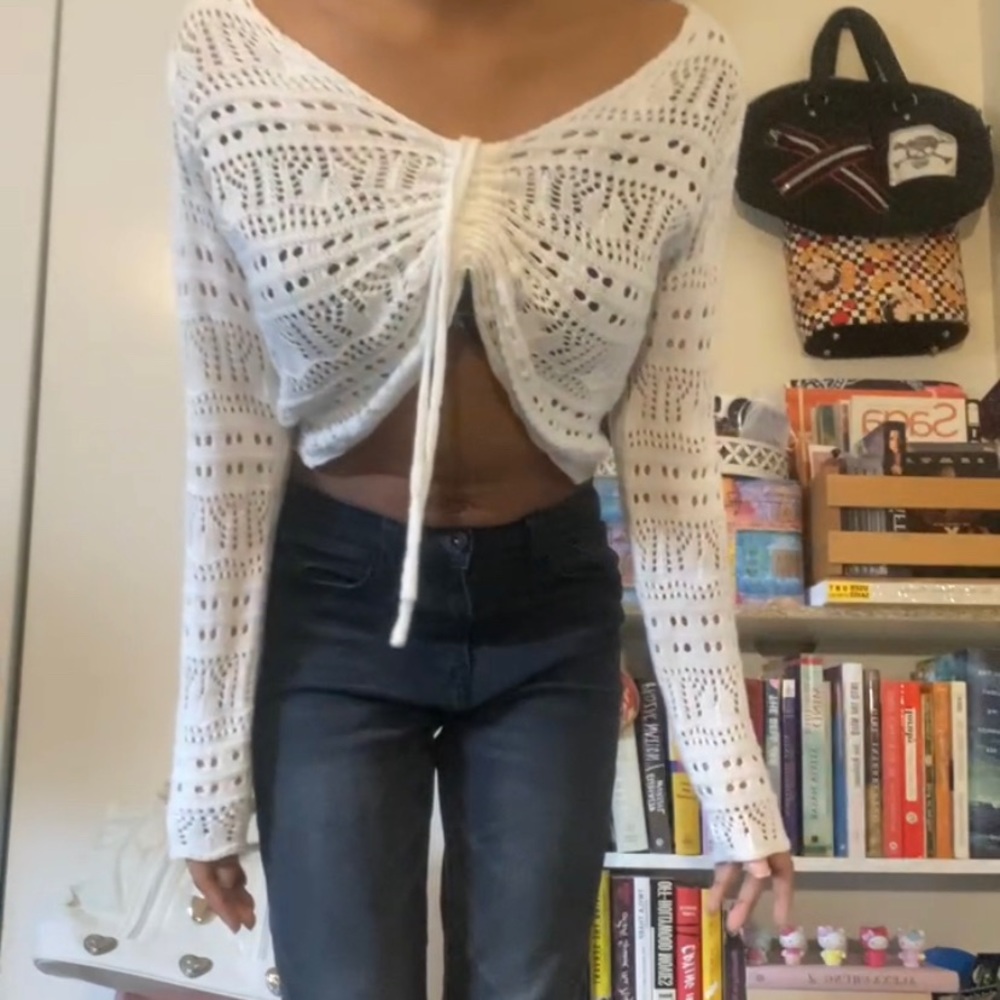doily-style knit cover up with a tie detail in front